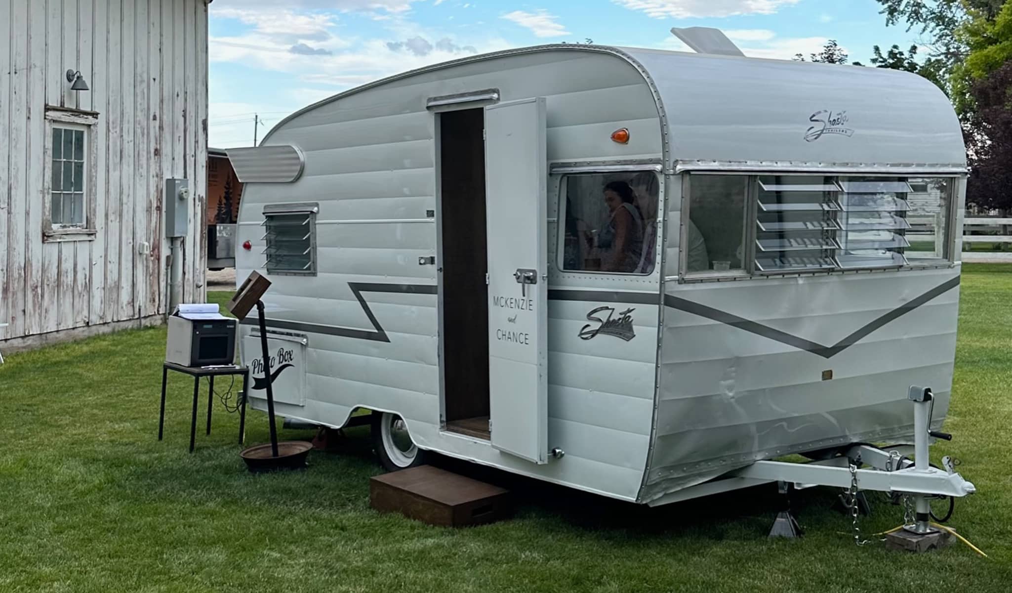 retro photo booth outside barn at wedding